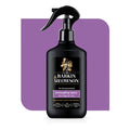 Black bottle of Barkin & Meawson detangling spray for pets on a purple background