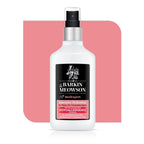 Spray bottle on white pink background