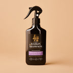 Barking & Meowson pet product spray bottle on a beige background