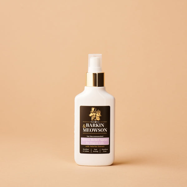 White bottle with a black label on a beige background