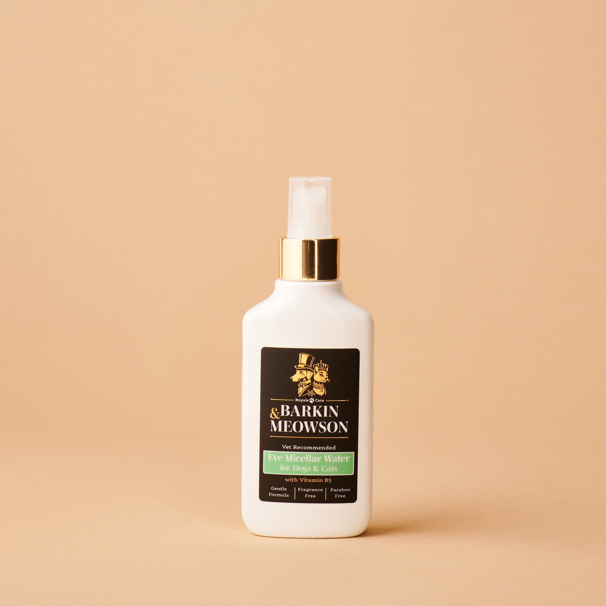 White spray bottle with a black label on a beige background
