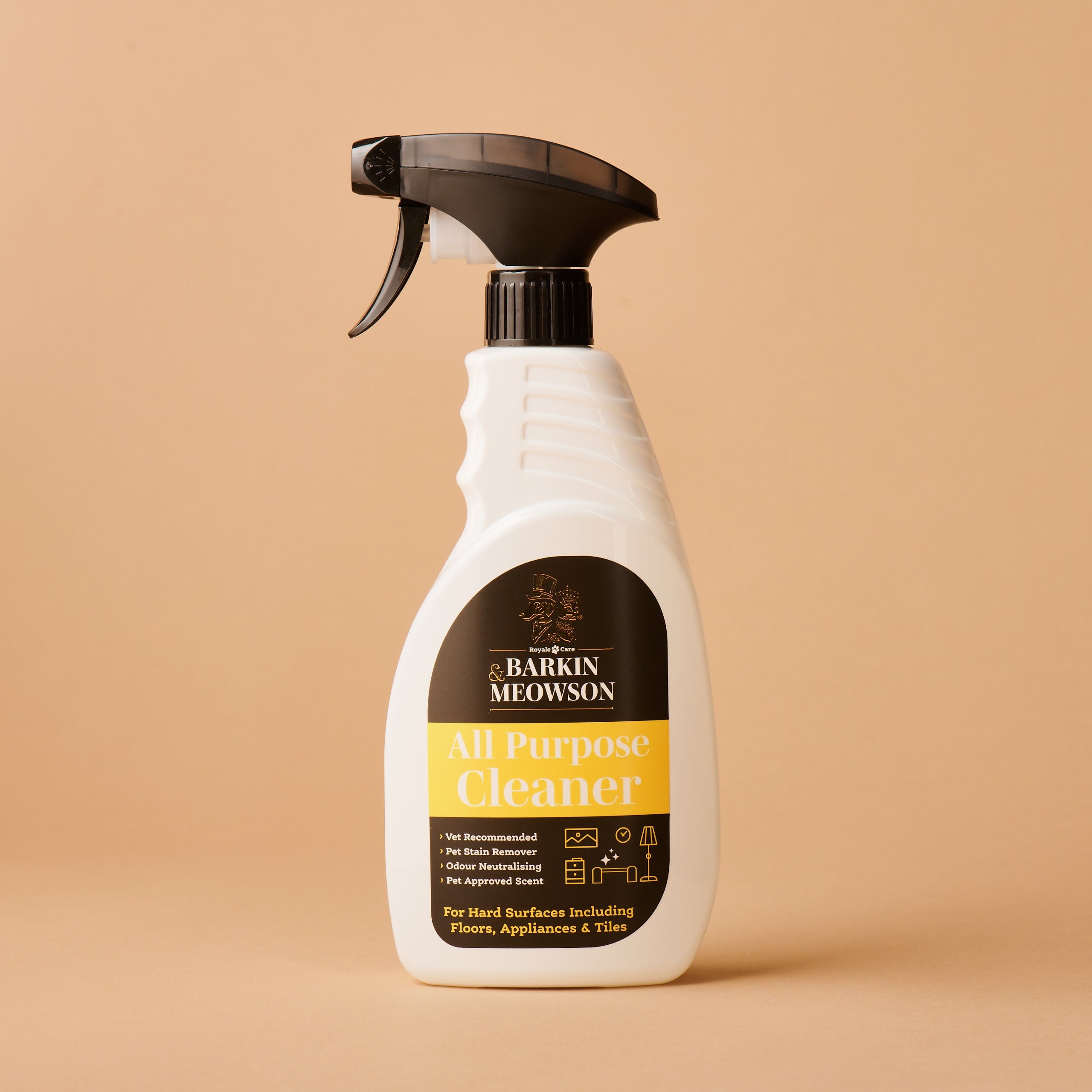 White spray bottle with black nozzle on a beige background