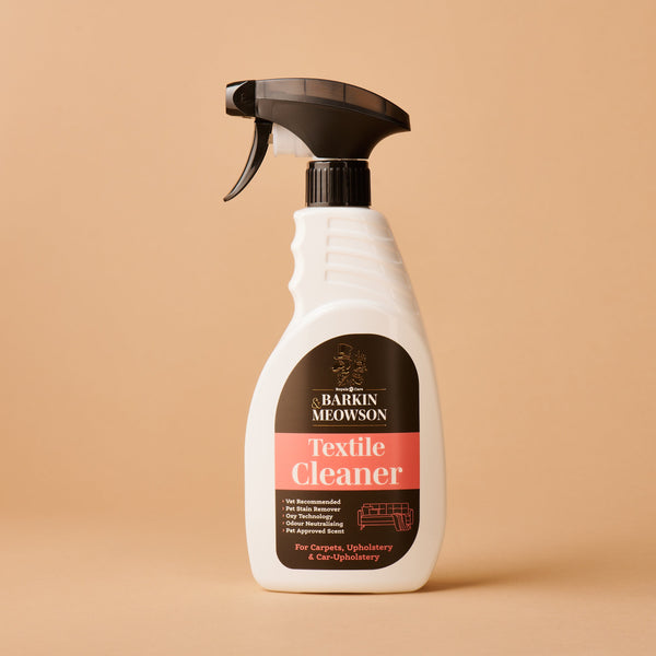 Spray bottle of Harkin Meowson Textile Cleaner on a beige background