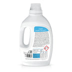 White bottle of liquid laundry detergent with label on a white background