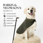 Dog wearing a green vest with product features listed on a white background