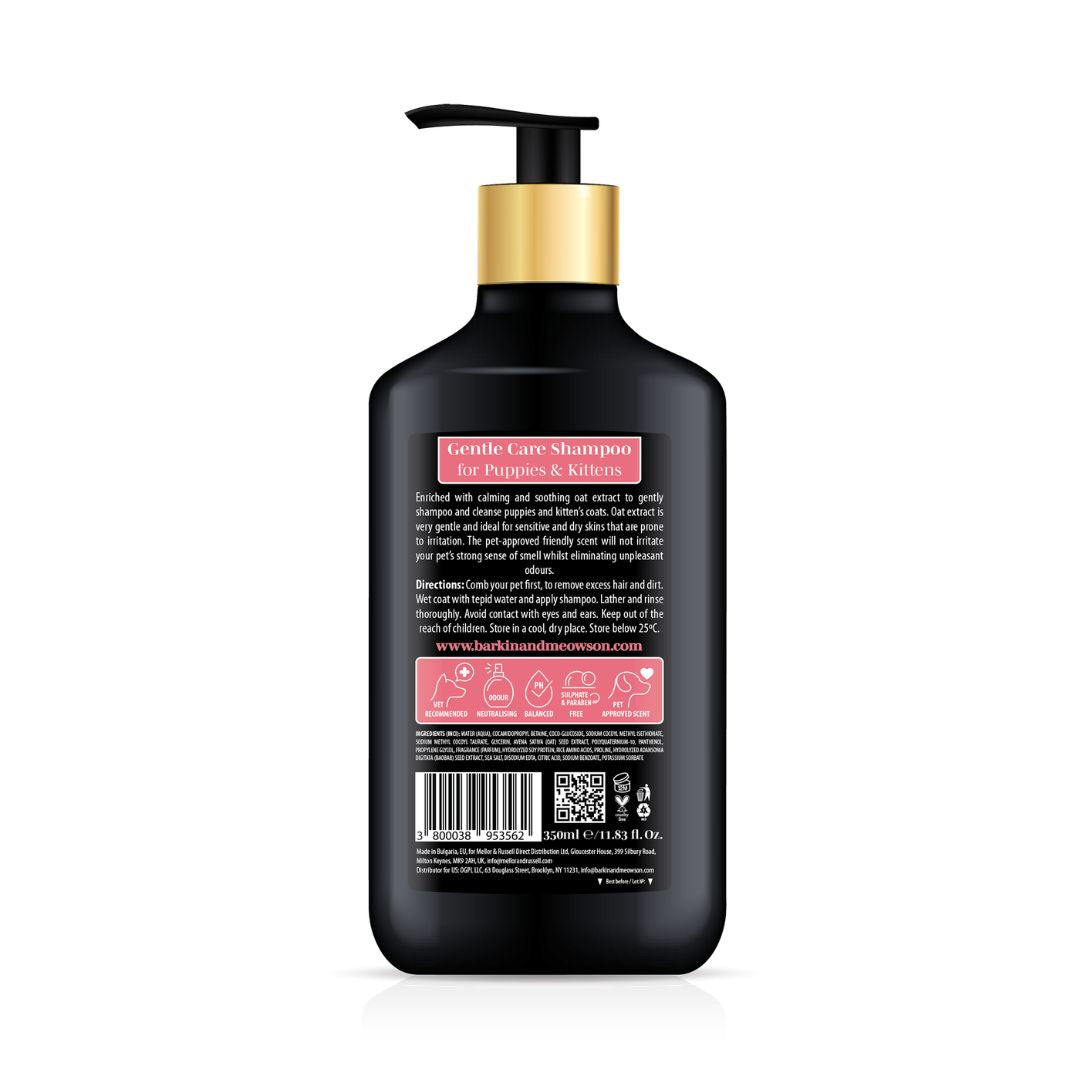 Black shampoo bottle with gold pump on a white background