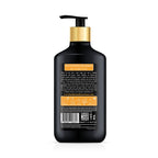 Black shampoo bottle with pump and gold cap on a white background