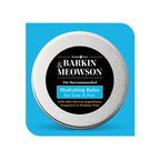 Barkin Meowson hydrating balm tin on a blue background